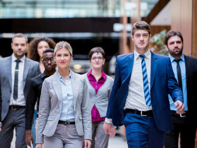 young multi ethnic business people group walking and standing